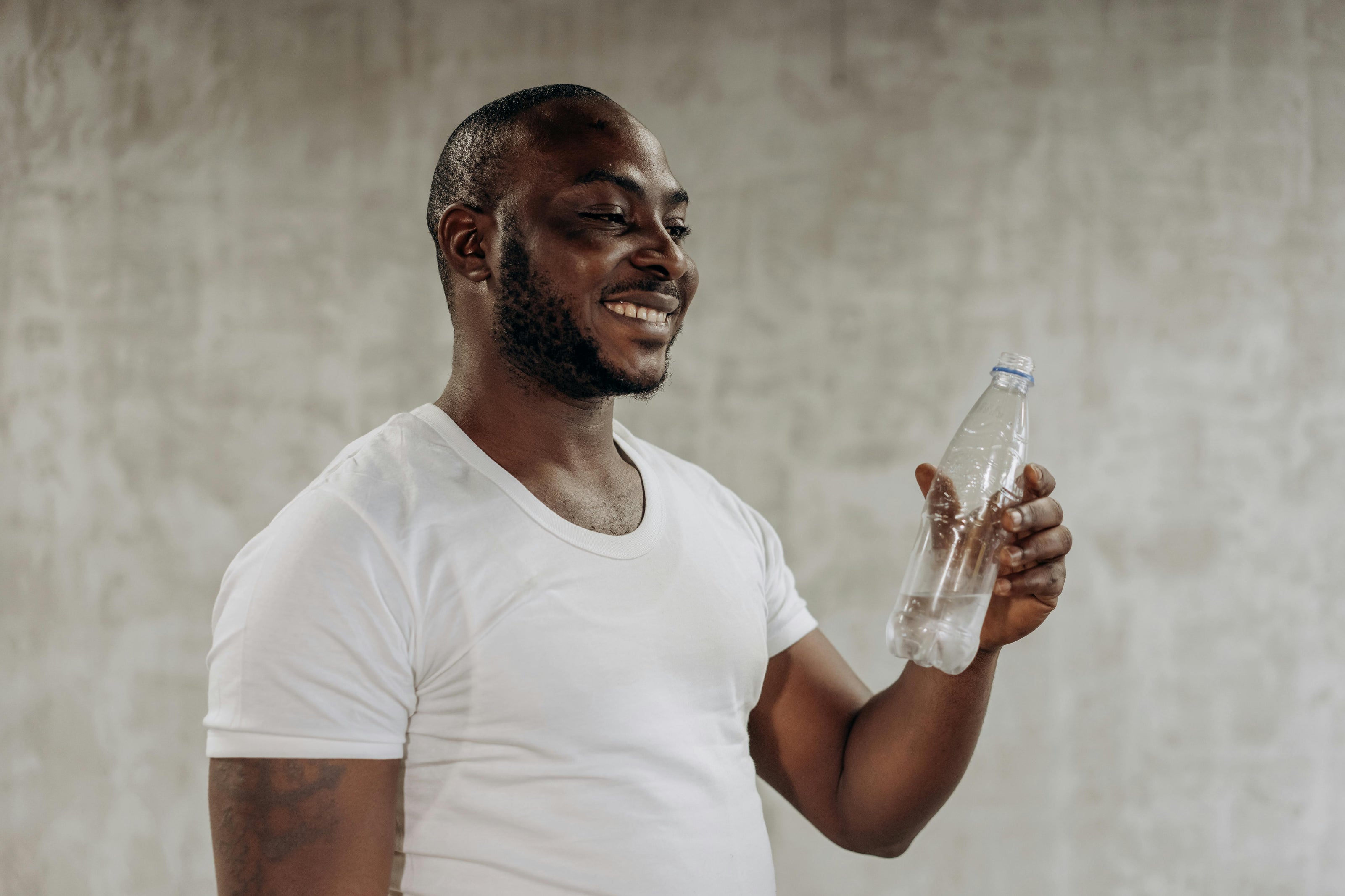 Man drinking water to stay hydrated