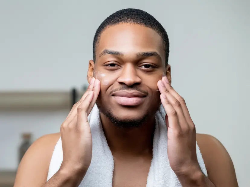 Man applying antiperspirant serum to his face for craniofacial hyperhidrosis