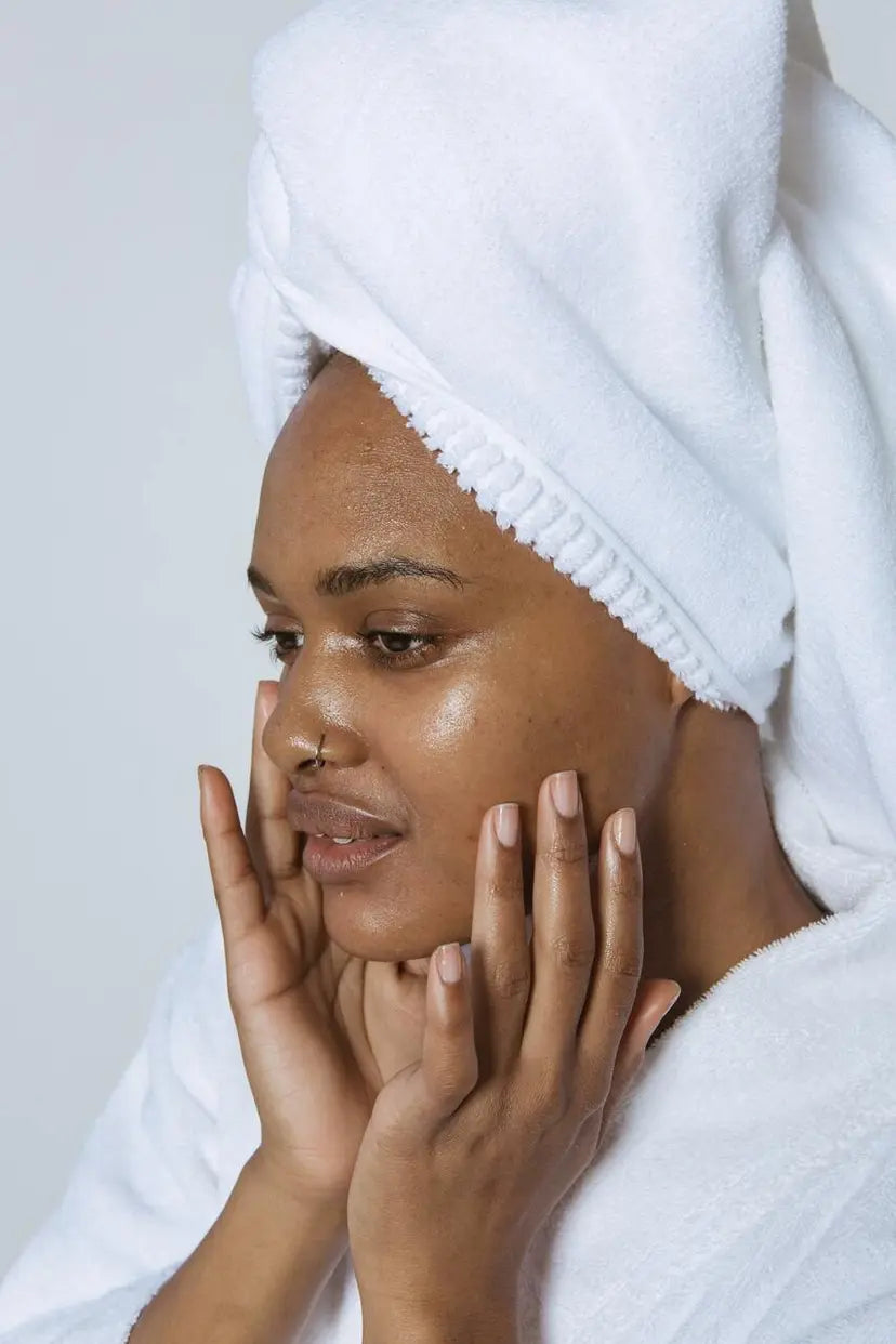 Woman applying prescription strength antiperspirant serum to her face to treat craniofacial hyperhidrosis