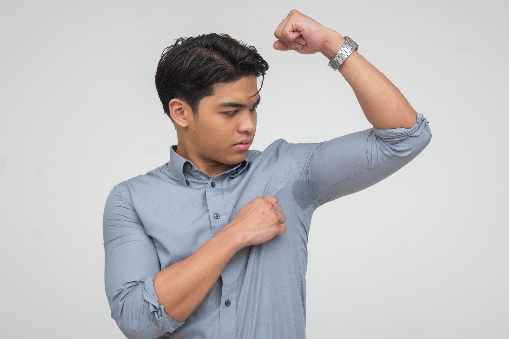 Person with sweaty underarms