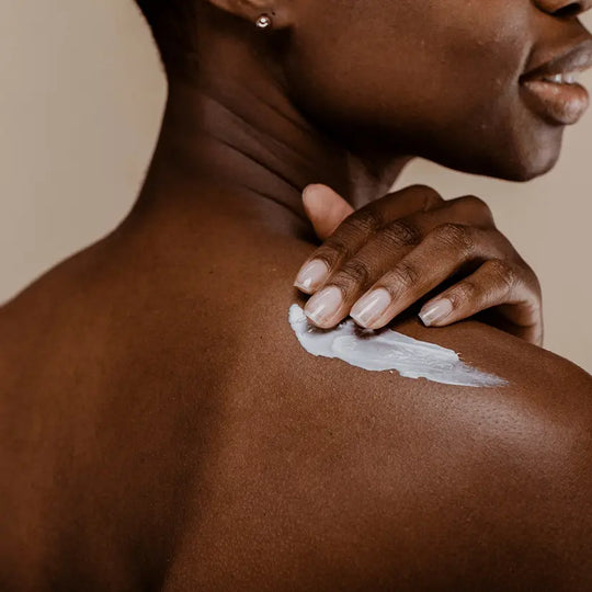 Woman applying product to stop sweating